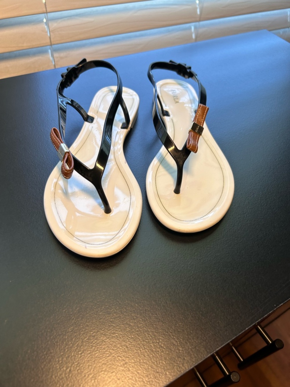 Furla patten jelly thong sandals featuring a black strap, brown bow detail 36/6